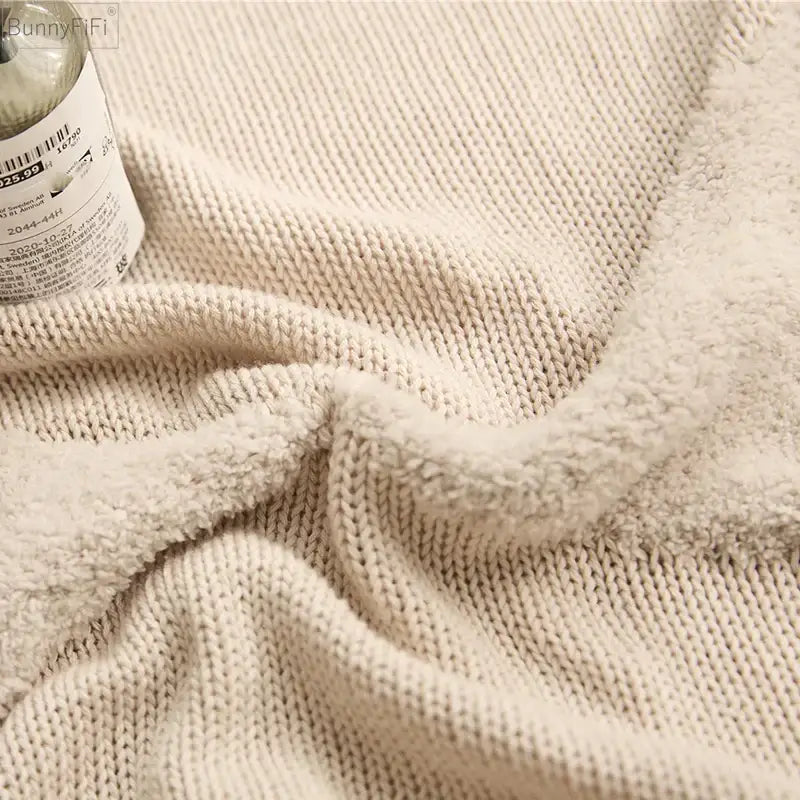 Cream-colored textured knit sweater with cozy ribbed pattern featured alongside decorbites knitted mustard cushion cover decor