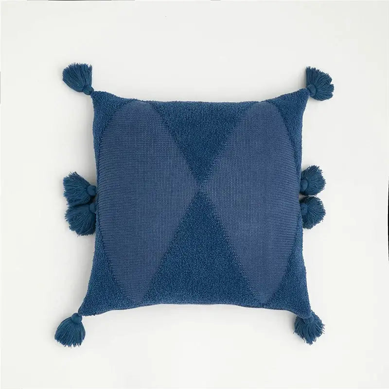 Deep blue woven throw pillow with textured diamond pattern and tassels complements decorbites knitted mustard cushion cover