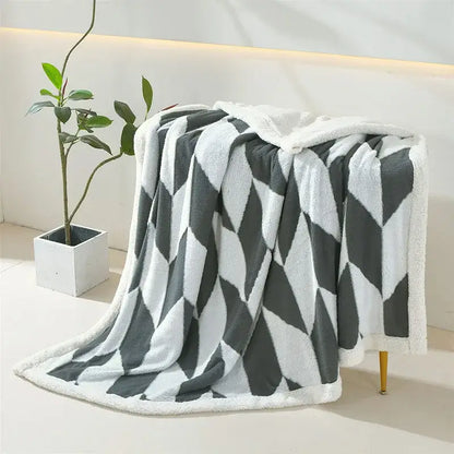A plush geometric lamb wool blanket in lavender and white with soft fleece texture ideal for cozy bedroom decorbites geometric lamb