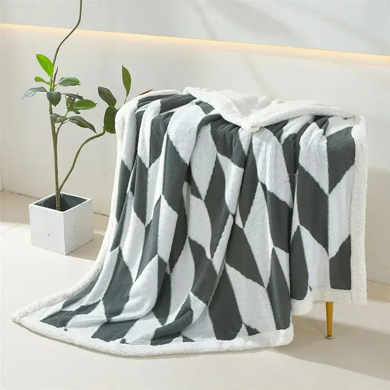 A plush geometric lamb wool blanket in lavender and white with soft fleece texture ideal for cozy bedroom decorbites geometric lamb
