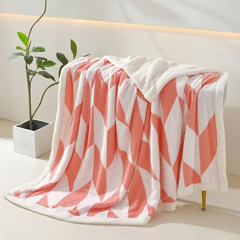Plush coral and white geometric lamb wool blanket with soft fleece texture for cozy decorbites geometric lamb decor
