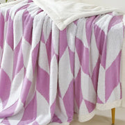 A plush lavender and white geometric lamb wool blanket with cozy fleece lining perfect for bedroom decorbites geometric lamb throw
