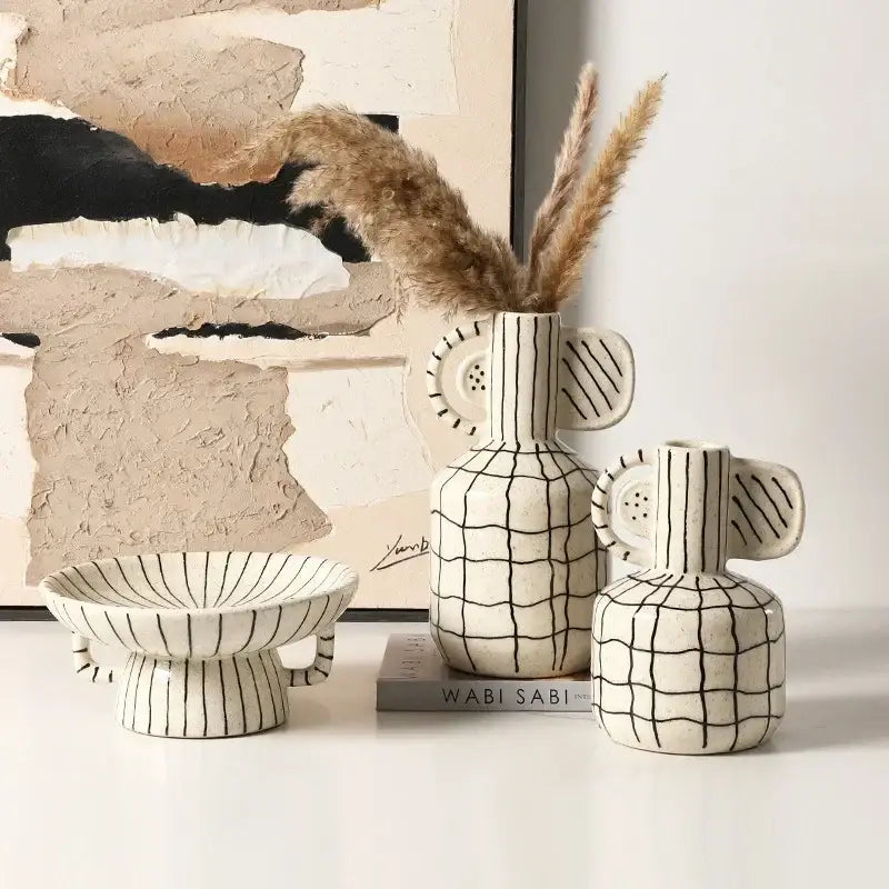 Cream-colored geometric line ceramic vase with black grid patterns and whimsical ear-like handles for living room decorbites decor