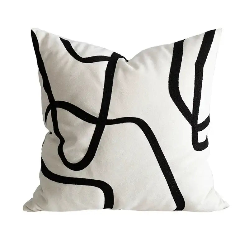 White throw pillow with bold black geometric line embroidered suede design for modern living room decorbites geometric line