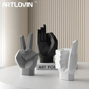 Set of three geometric hand gesture art decor sculptures in matte gray black and white resin for living room use