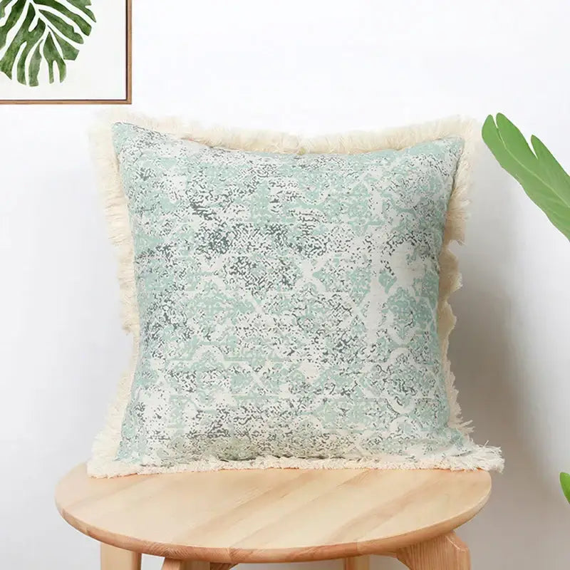 Square mint green cushion cover with subtle distressed pattern cream fringed edges decorbites cotton crochet tassel