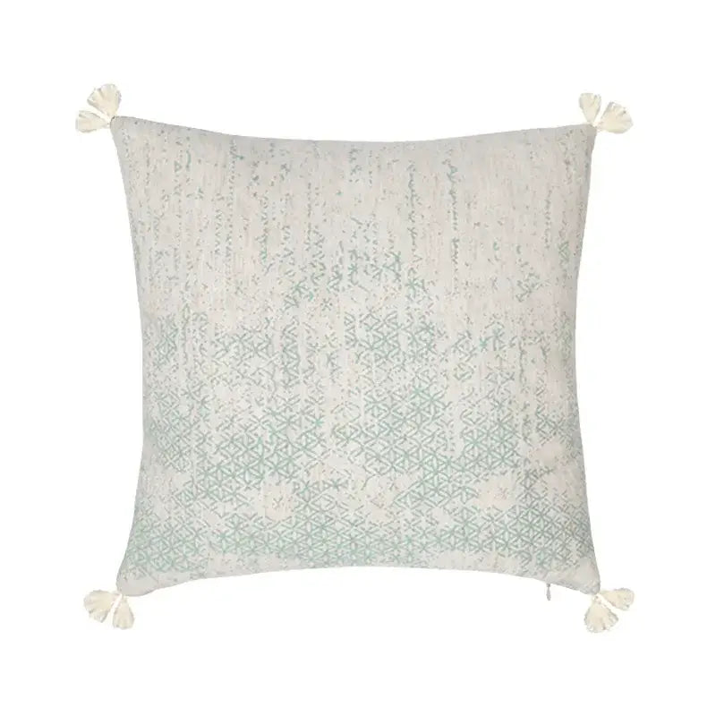 Square cushion cover in pale mint green and off-white with geometric embroidery made of decorbites cotton crochet tassel