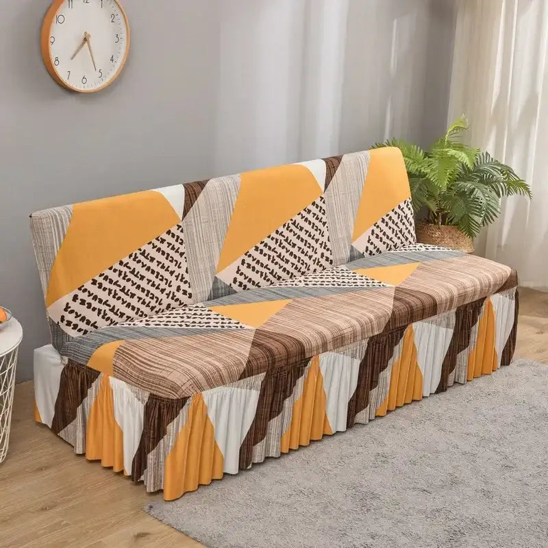 A vibrant geometric-patterned mustard yellow elastic armless futon sofa cover with ruffled hem for living room