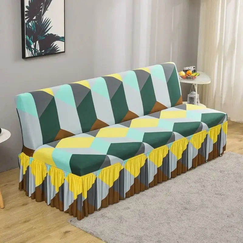 A vibrant geometric-patterned elastic armless futon sofa cover in green yellow gray and brown with ruffled hem