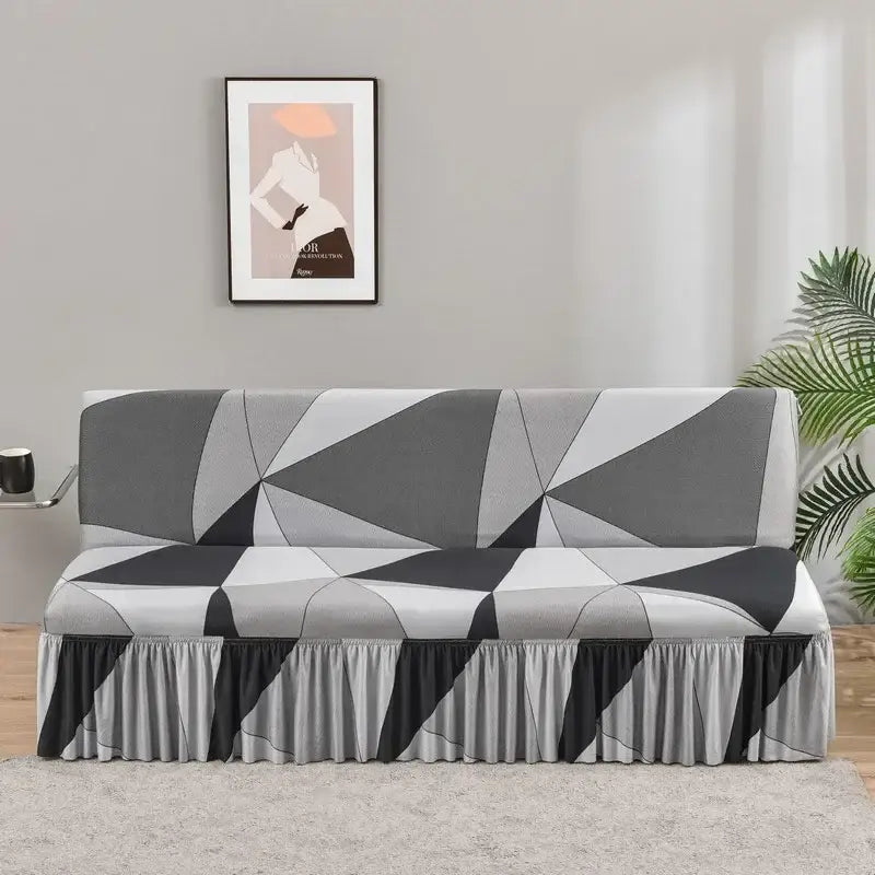 A sleek gray and black geometric-patterned elastic armless futon sofa cover with ruffled hem for living room use