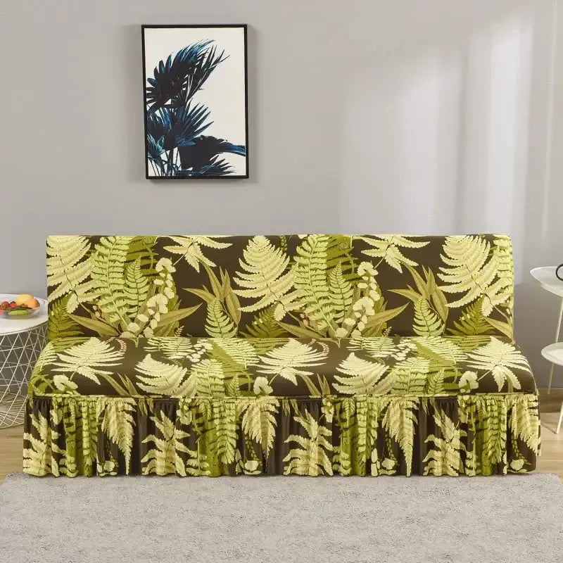 A vibrant green and brown fern-patterned elastic armless futon sofa cover with ruffled hem for living room use