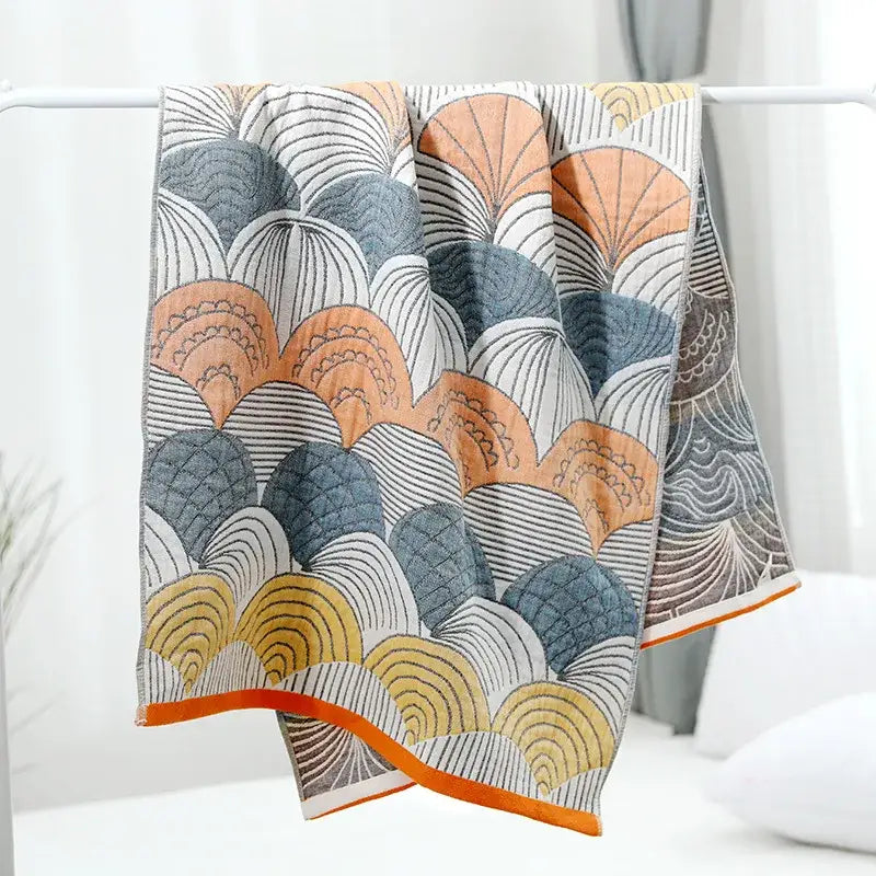 Geometric orange and blue cotton gauze bath towel set featuring a soft absorbent decorbites cotton gauze with wave pattern