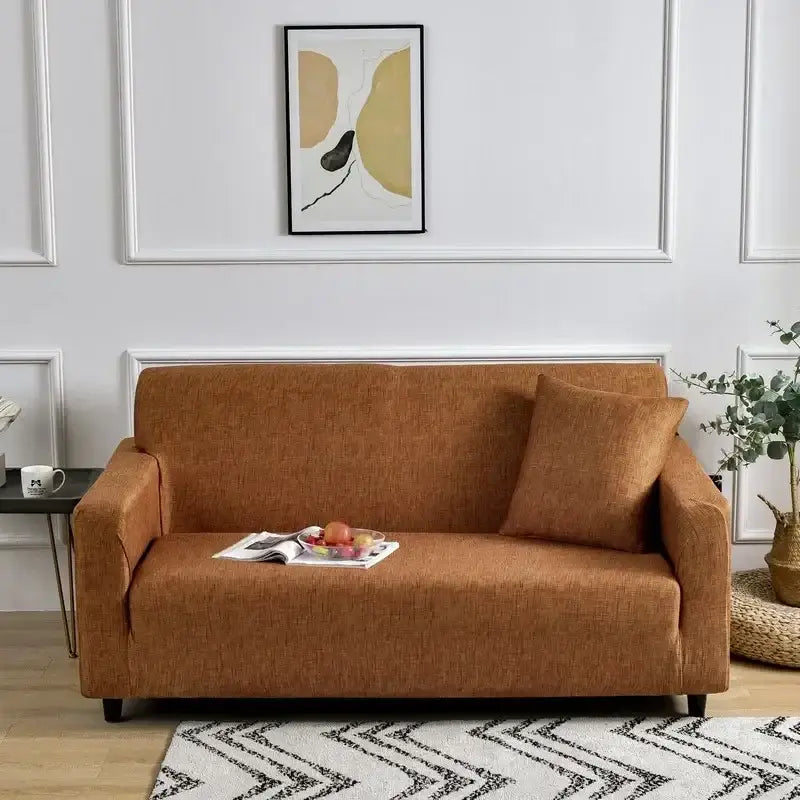 Warm brown textured fabric sofa cover snugly fitted on modern loveseat featuring decorbites colorful block design