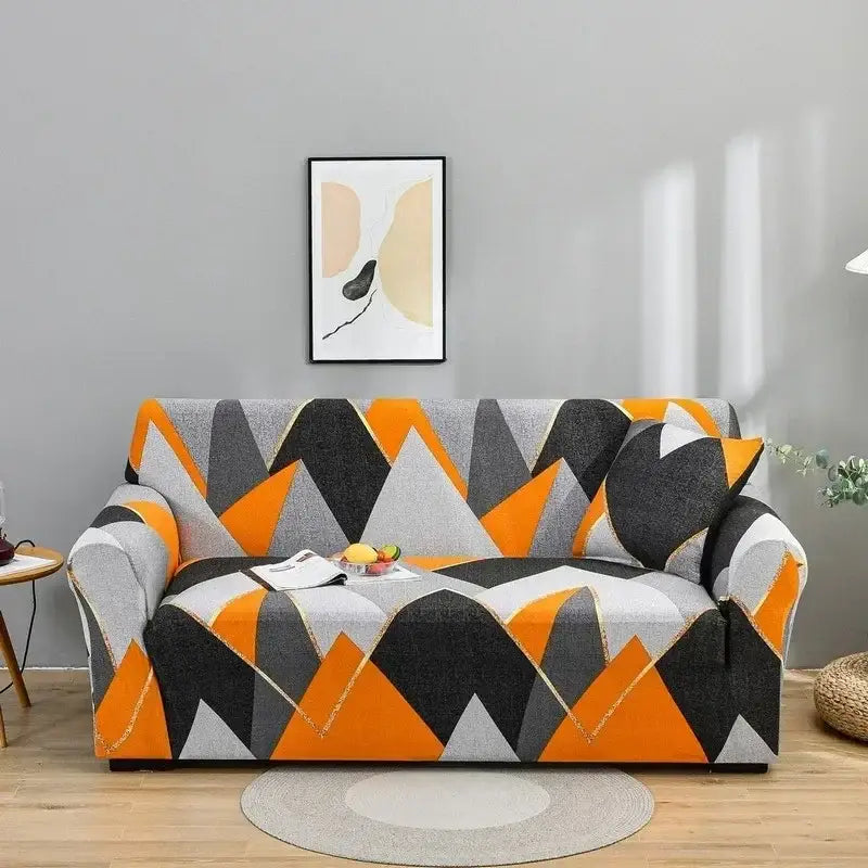 A vibrant geometric orange black and gray colorful block sofa cover from decorbites enhances living room decor