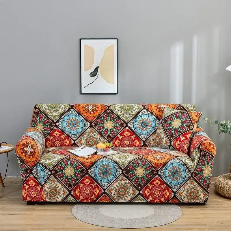 A vibrant stretchy geometric orange and gray colorful block sofa cover with mandala patterns by decorbites