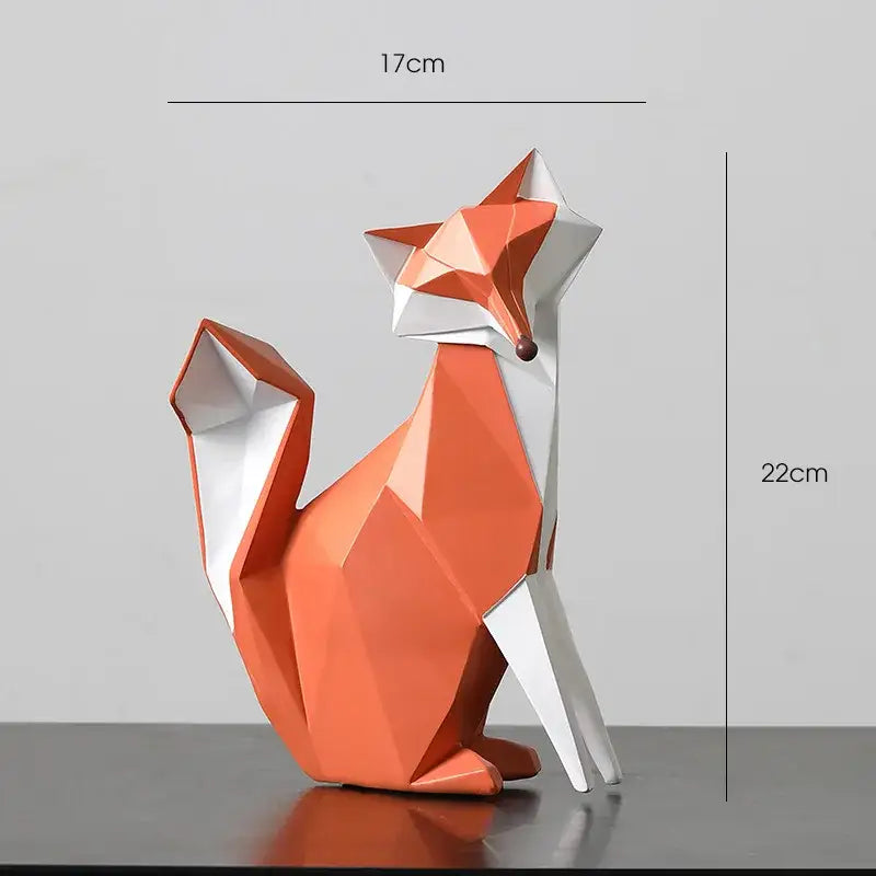 A geometric orange and white decorbites fox figurine with glossy angular facets and a small brown nose for living room decor
