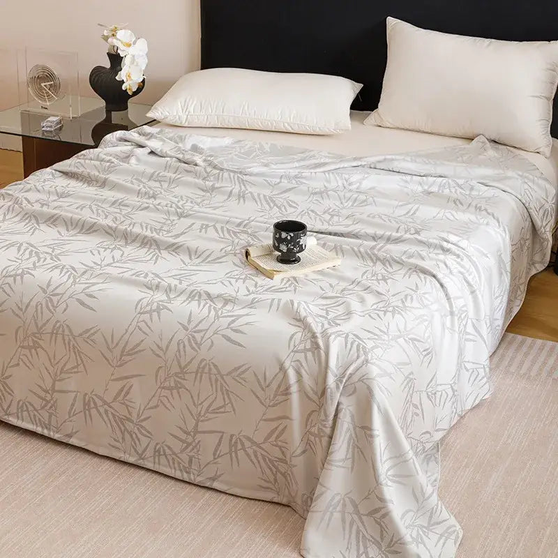 A soft light gray geometric pink bamboo fiber summer blanket with subtle leaf pattern for lightweight bedding decorbites bamboo fiber