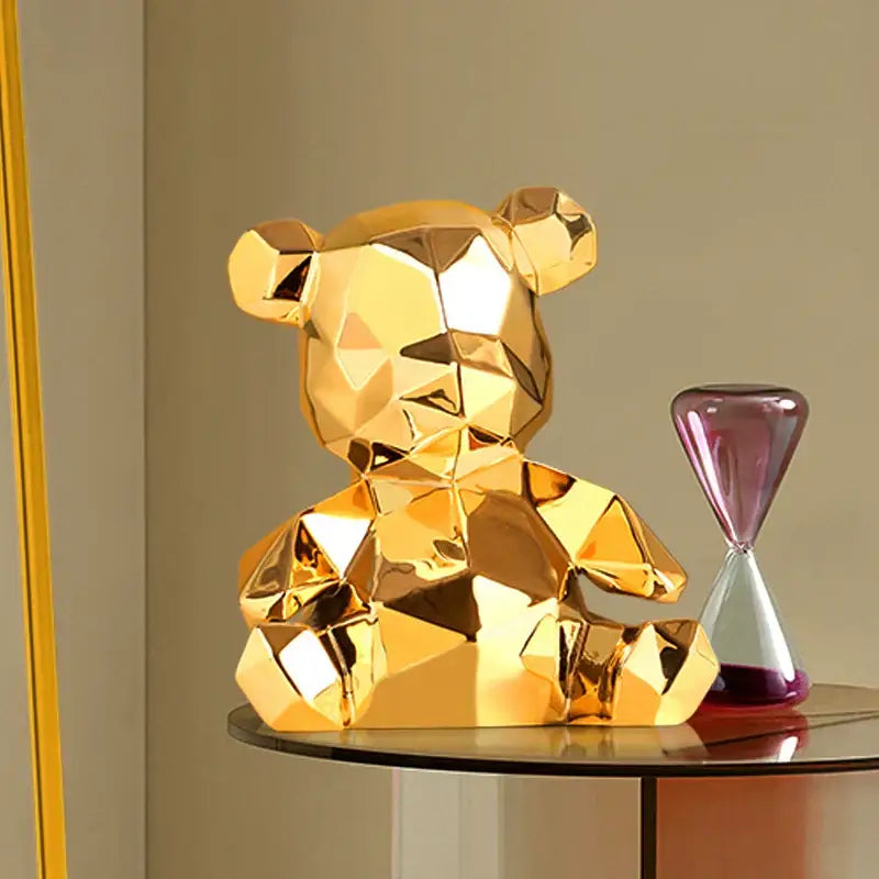 Golden faceted electroplated teddy bear sculpture with geometric design for living room decor