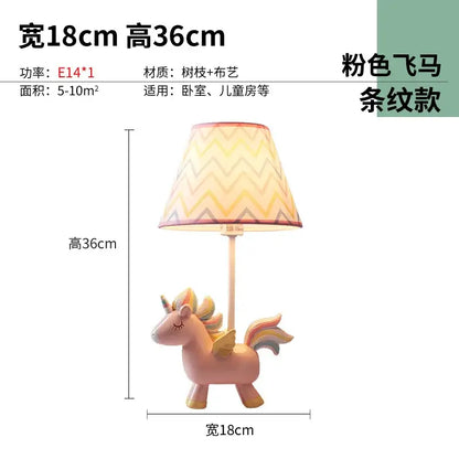 Pink unicorn table lamp with chevron-patterned shade for children’s bedroom featuring geometric pink and blue design