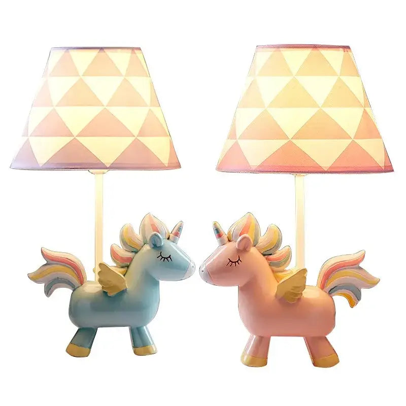 Two pastel pink and blue unicorn table lamps with geometric patterned shades for children’s bedroom decor