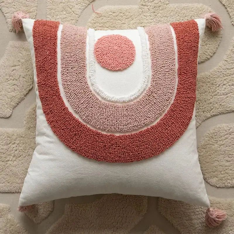 A cozy square geometric embroidered pillow cover in coral and blush pink with tassels for living room decorbites cushion covers