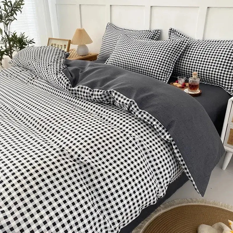 Black and white gingham quilt cover set with solid dark gray inner lining for geometric pink and white gingham bedroom