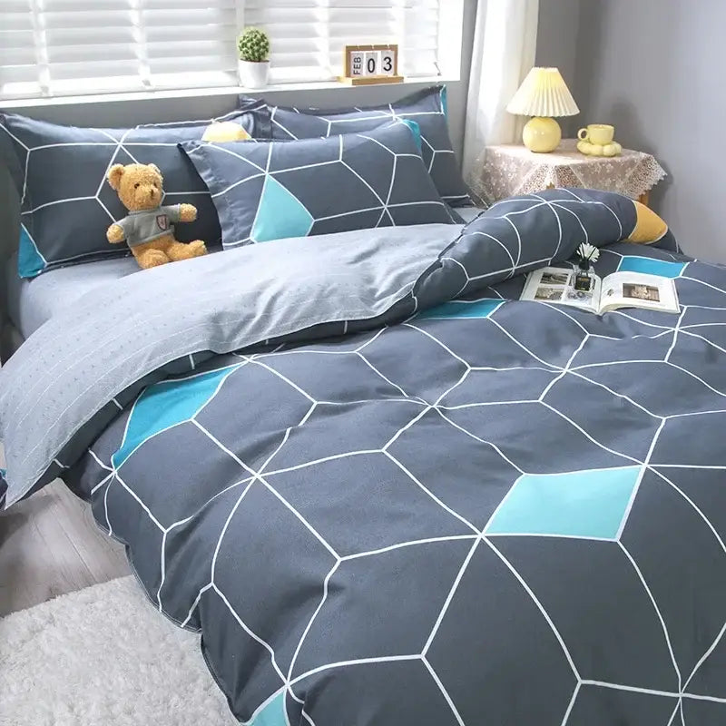 Geometric pink and white gingham ruffled quilt cover set with gray and teal geometric-patterned duvet cover set and white lines