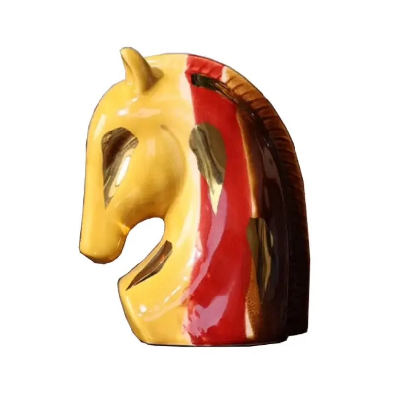 Glossy ceramic geometric horse head sculpture with vibrant yellow face and red dark brown mane stripes for living room decor