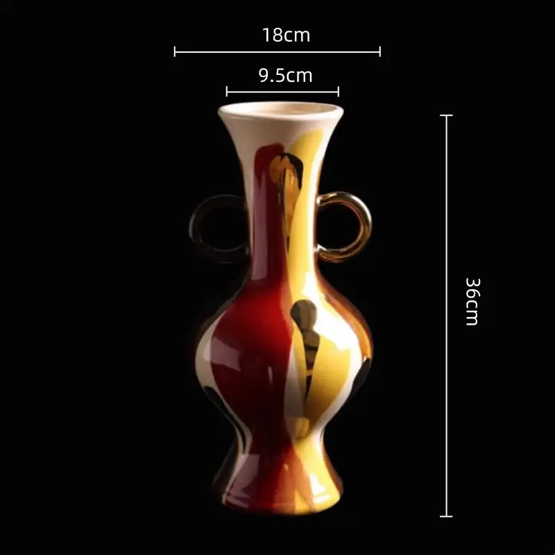 A glossy ceramic vase with a geometric horse head design in red and yellow gradient for living room decor