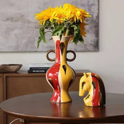 Vibrant red and yellow geometric horse head ceramic vase with dual handles and glossy glaze for living room decor
