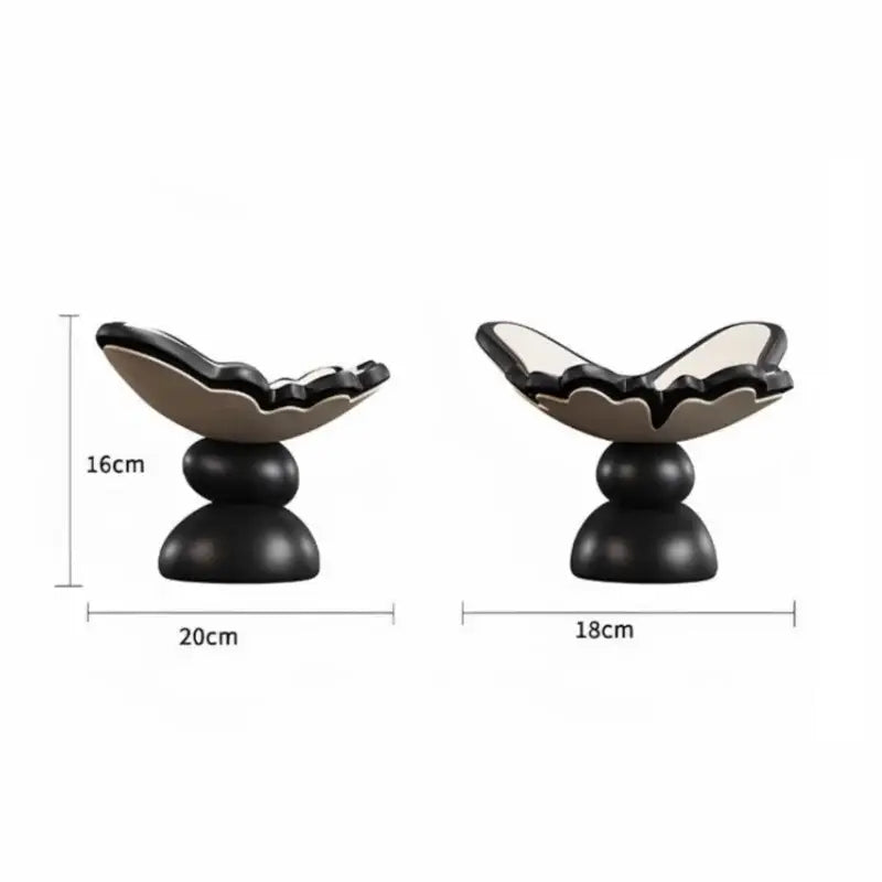 Black and white ceramic shell-shaped butterfly geometric resin tray on a two-tiered base for dining room storage