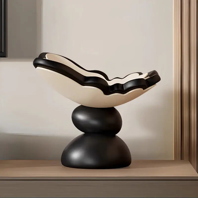 Black and white ceramic butterfly geometric resin tray with scalloped bowl on stacked rounded bases for dining room storage
