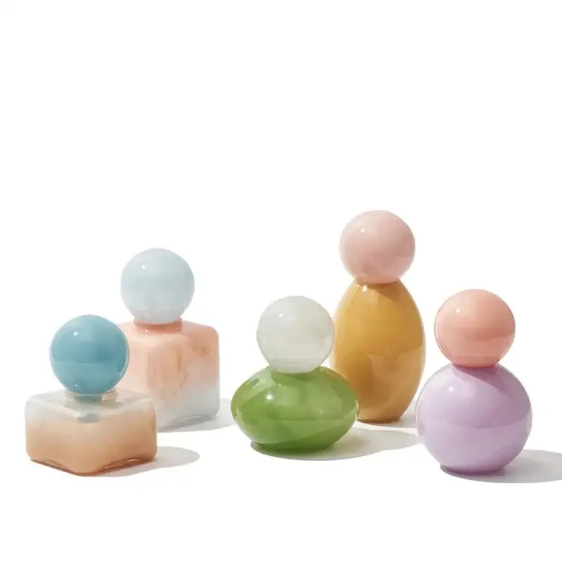 Pastel-colored geometric sphere glass vase with lid in soft blue pink green yellow and purple for desktop storage