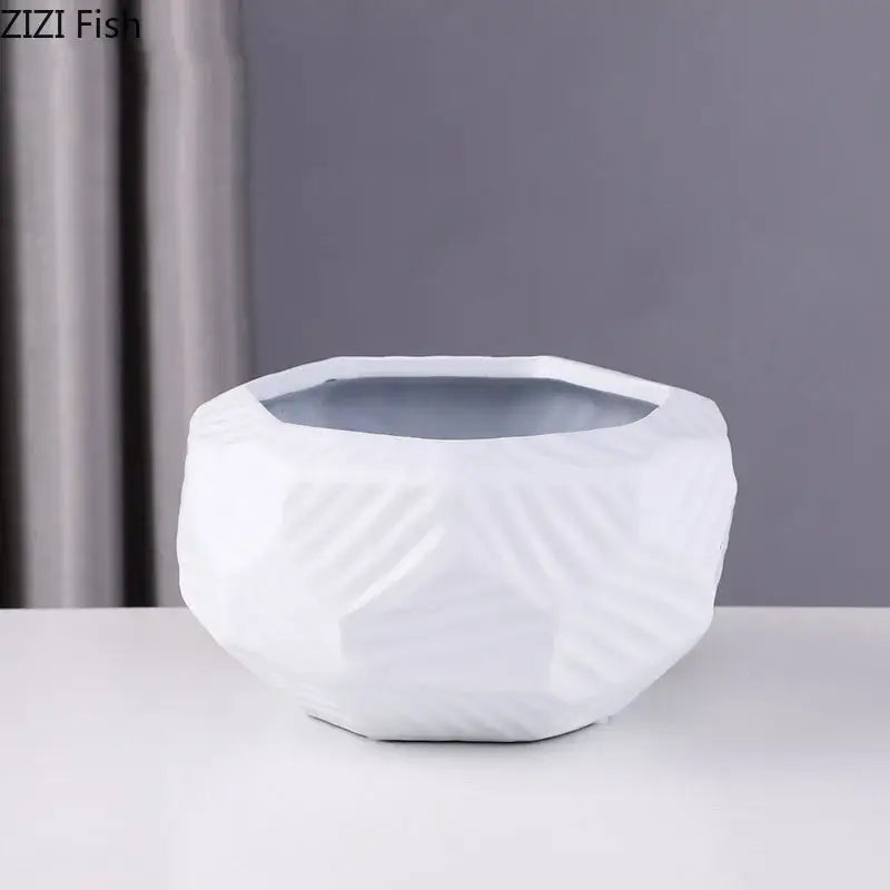 White ceramic vase with faceted geometric design and subtle texture minimalist ceramic vase decorbites ceramic vase