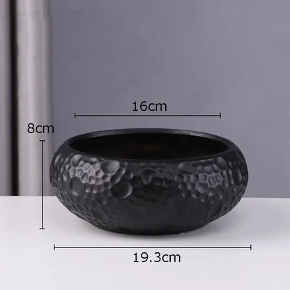 Black ceramic vase with textured hammered surface and rounded shape, ideal minimalist ceramic vase for decorbites decor