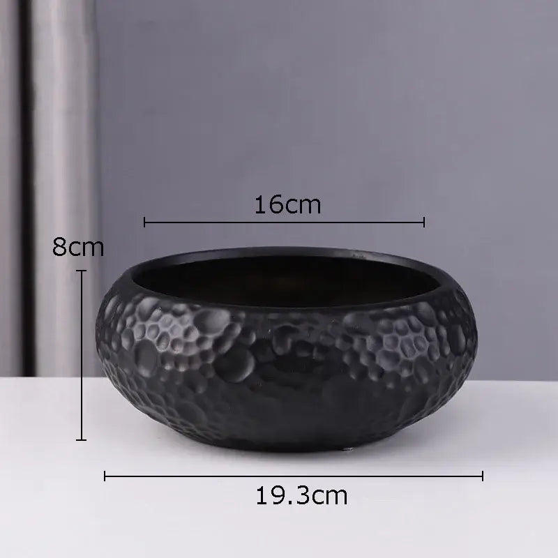 Black ceramic vase with textured hammered surface and rounded shape, ideal minimalist ceramic vase for decorbites decor