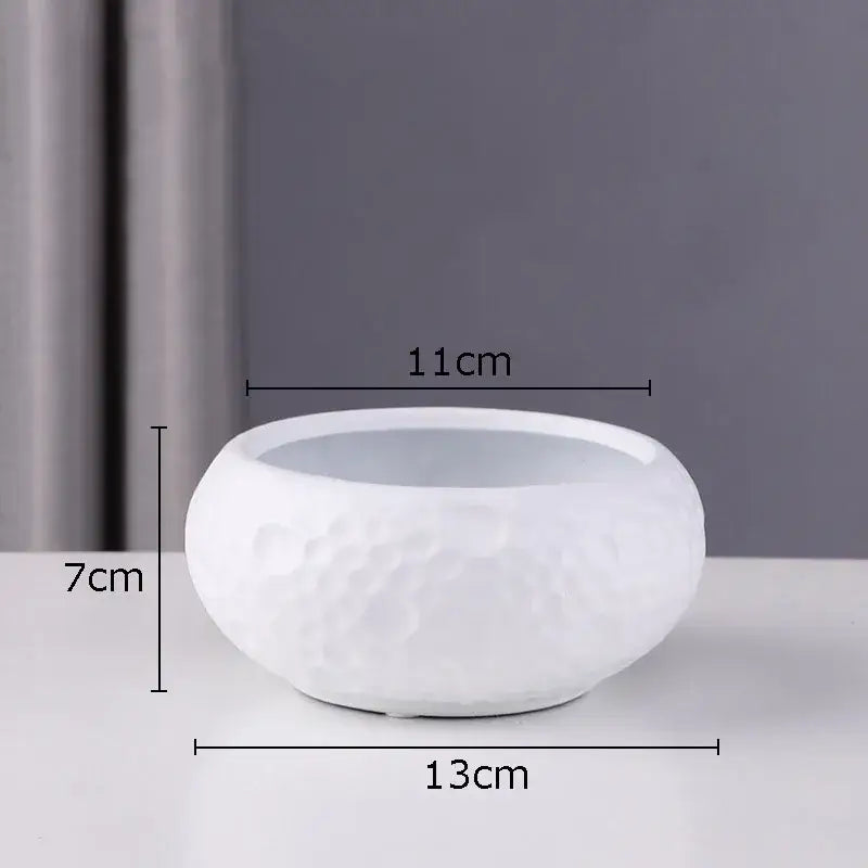White ceramic minimalist ceramic vase with textured hammered surface and rounded bowl shape for decorbites decor