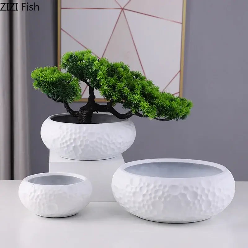 White ceramic vase with textured hammered surface and dark brown tree for minimalist ceramic vase decorbites decor