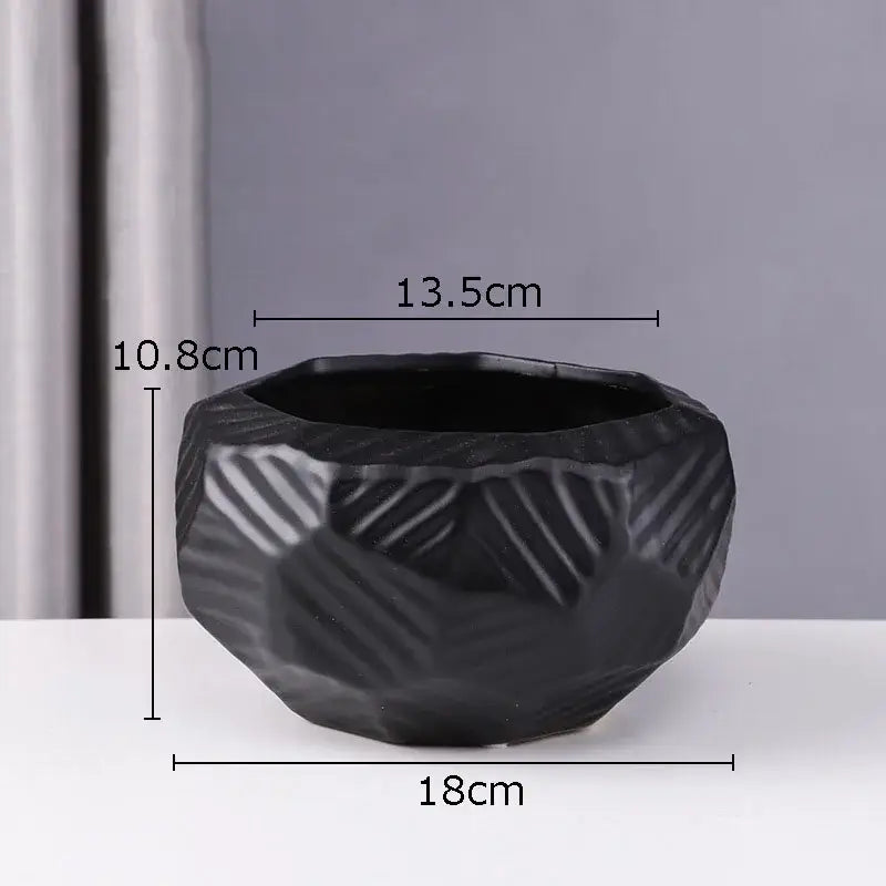 Black ceramic vase with faceted geometric design and subtle diagonal ridges minimalist ceramic vase decorbites ceramic vase