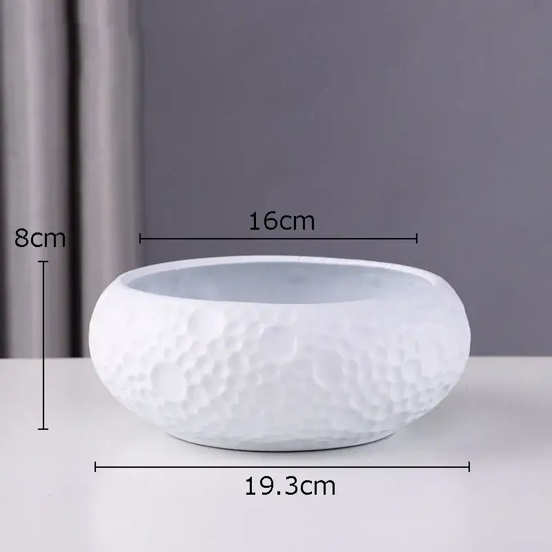 White ceramic minimalist ceramic vase with textured hammered surface for geometric stacked decorbites ceramic vase display