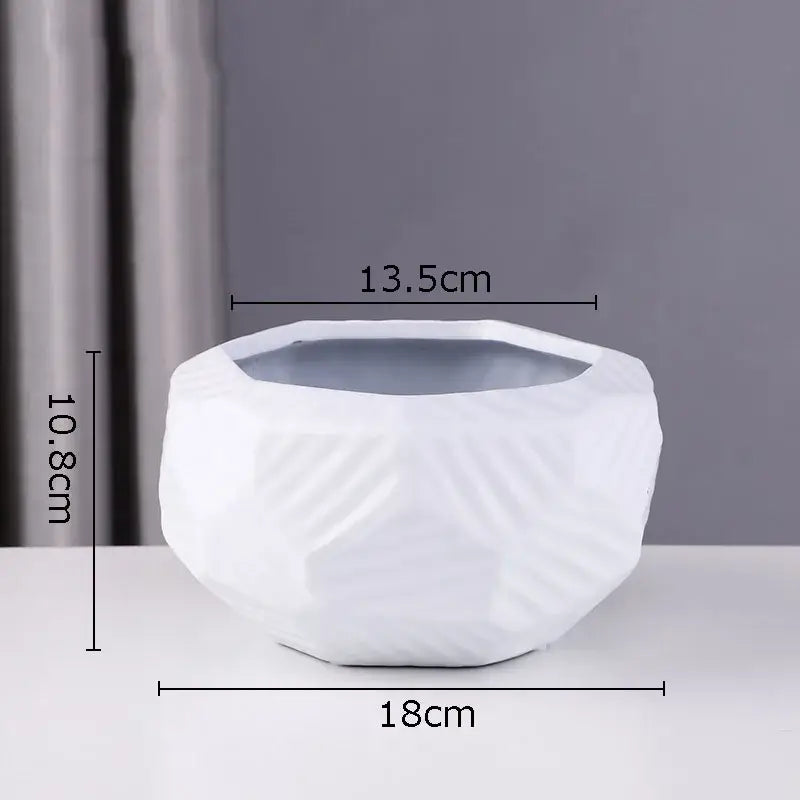 White ceramic vase with geometric faceted design and glossy finish minimalist ceramic vase decorbites ceramic vase
