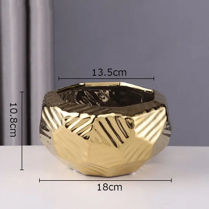 Gold-colored minimalist ceramic vase with faceted geometric design and textured surface for living room decorbites decor