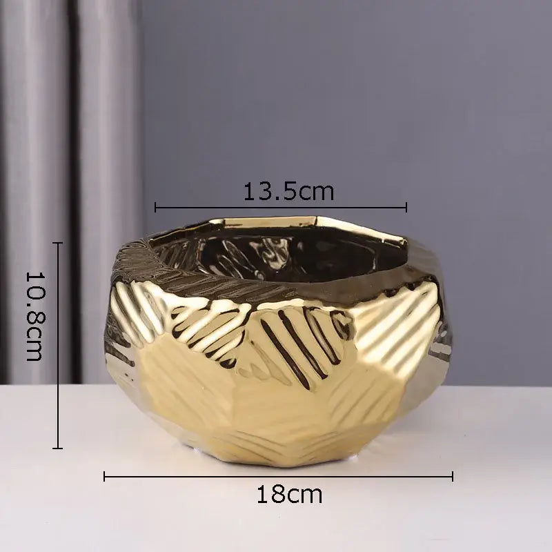 Gold-colored minimalist ceramic vase with faceted geometric design and textured surface for living room decorbites decor