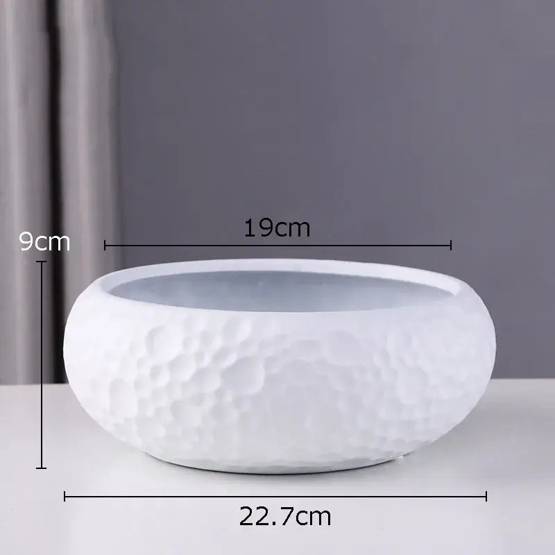 White ceramic vase with a textured hammered surface and smooth rim for minimalist ceramic vase decorbites decor