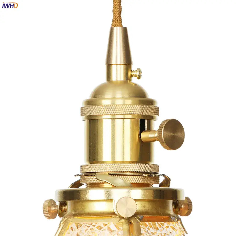 Brass-finished geometric star glass copper led pendant light with textured woven cord and intricate metal detailing for kitchen