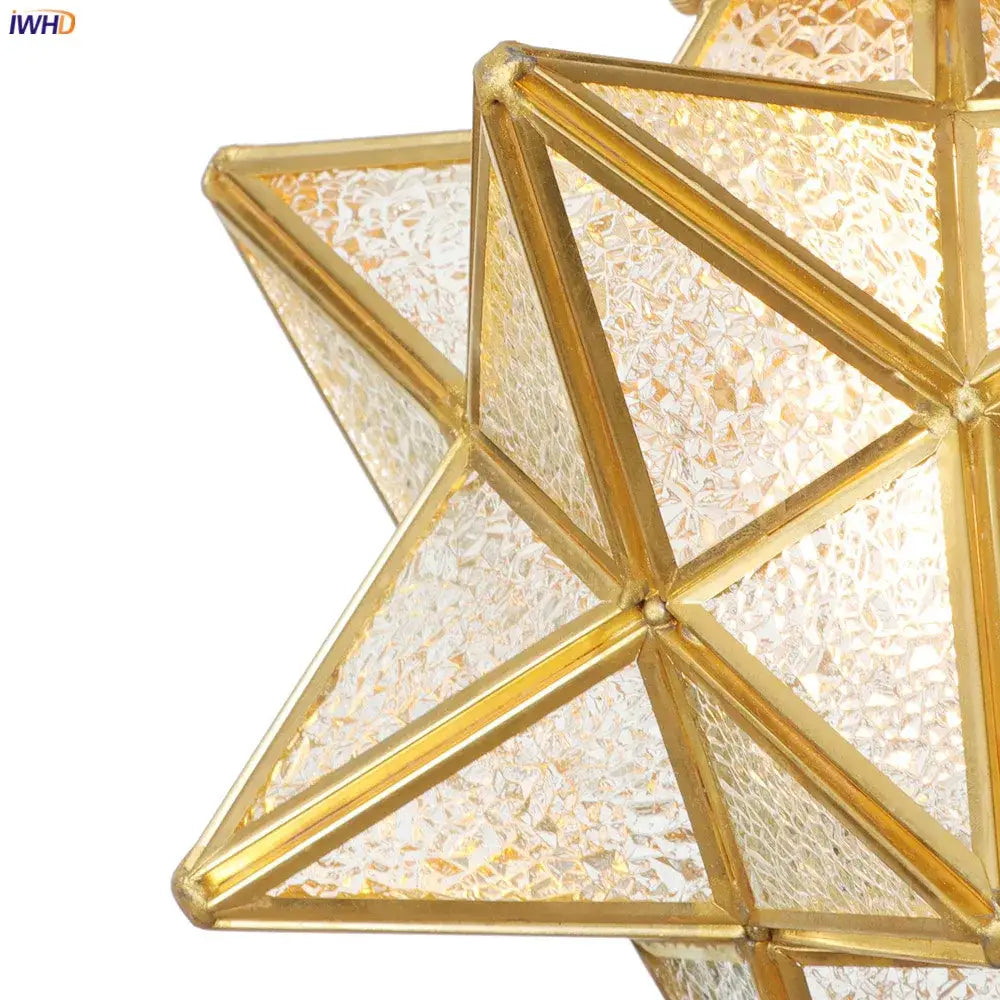 Golden star-shaped pendant light with textured translucent glass panels and brass copper led frame for kitchen