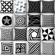 A collection of sixteen black and white geometric star print pillow covers on soft fabric for home decor by decorbites