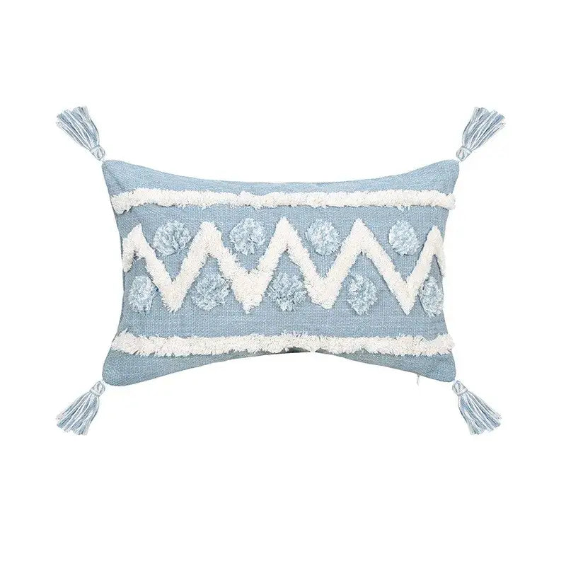 Light blue geometric tassel tufted pillow cover with white star embroidery, pom-poms, frayed edges, and tassels for living room