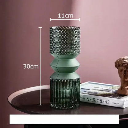A tall segmented green crystal clear glass vase with textured upper section and ribbed base for living room decorbites decor
