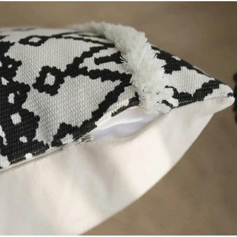 Black and white geometric tufted cotton cushion cover with woven pattern and frayed edge for decorbites tassel decor